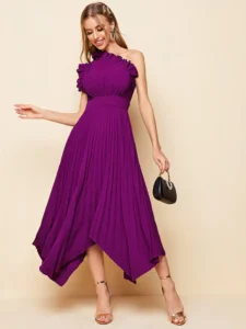 Image of a bridesmaid wearing an elegant one-shoulder dress with ruffle details and a pleated hanky hem, adding a romantic touch to the wedding party ensemble