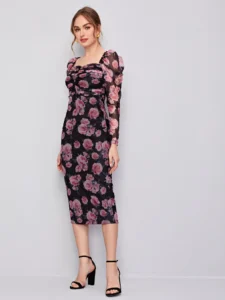 Image of a woman wearing a SHEIN Classic Ruched Detail Gigot Sleeve Floral Mesh Dress, showcasing its elegant floral pattern, graceful gigot sleeves, and intricate ruched detail, ideal for sophisticated occasions