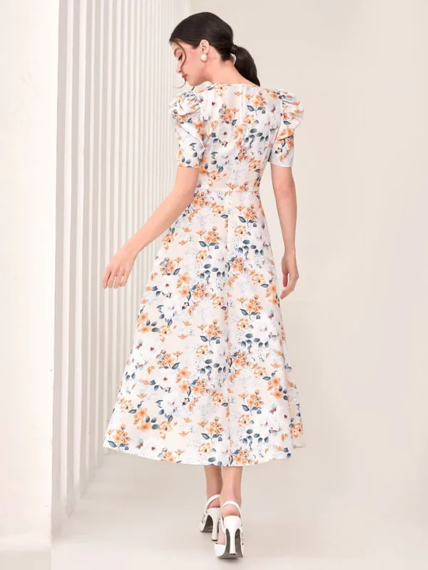 Image of a woman wearing a SHEIN Floral Print Puff Sleeve Dress, showcasing its vibrant floral design and fashionable puff sleeves, perfect for adding a touch of romance to any outfit.