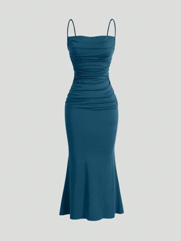 Image of a woman wearing a SHEIN Solid Ruched Mermaid Hem Cami Dress, showcasing its elegant design with ruched detailing and a flattering mermaid hem